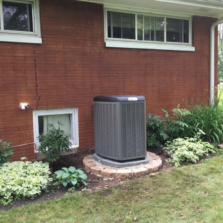 New AC Unit installed out side red brick house