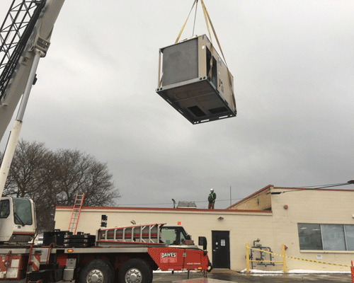 Crane Installing HVAC Products