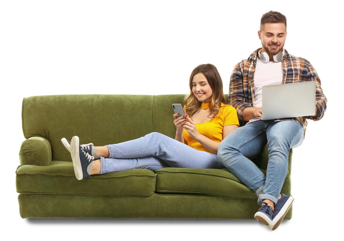 Couple Relaxing In Air Conditioning on Couch